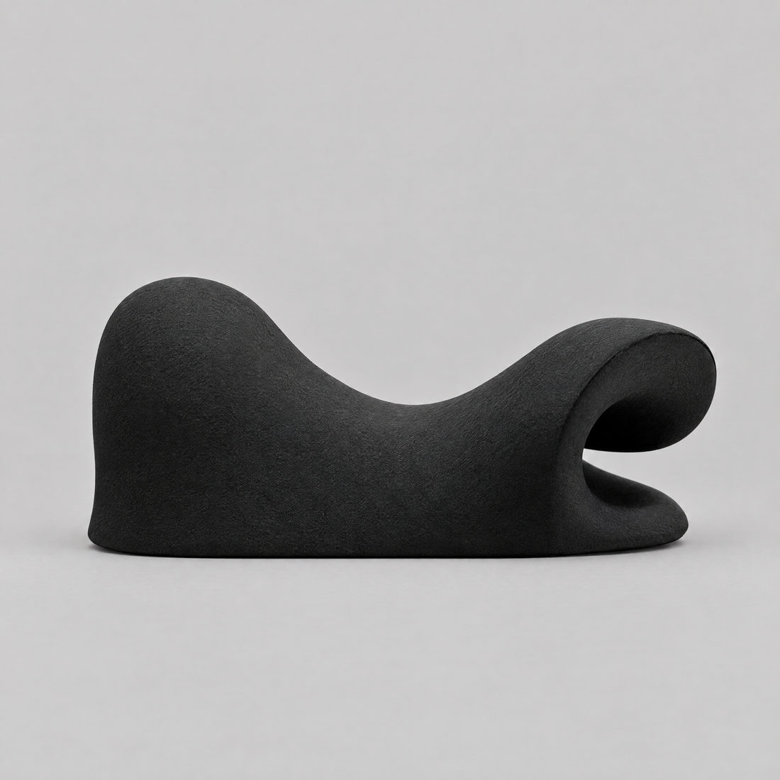 Side view of the CerviRelief Pro neck stretcher, showing the neck ridge and head cradle of its cervical traction pillow shape